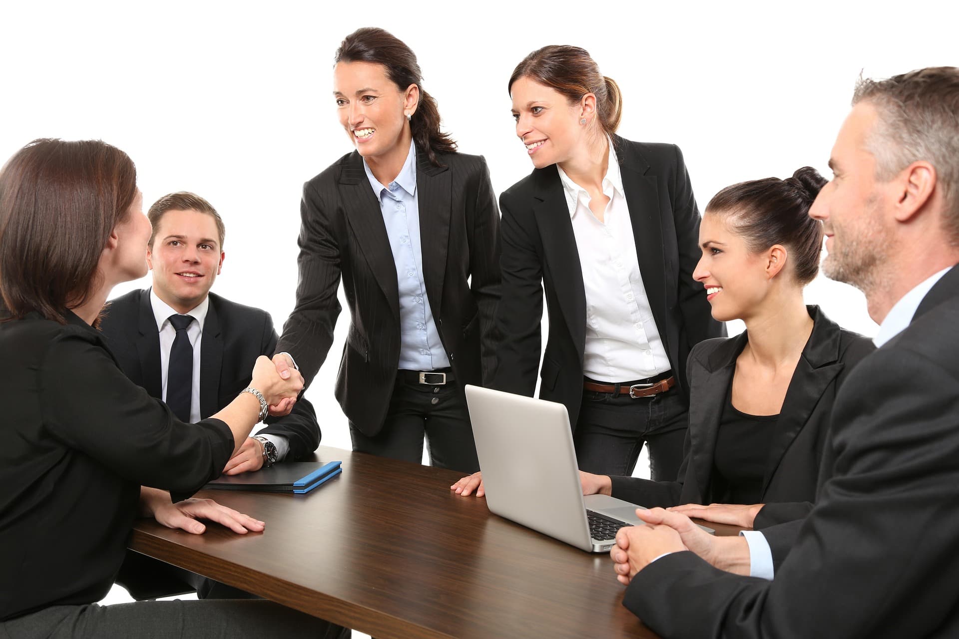A facilitator gesturing as a team listens during a working session